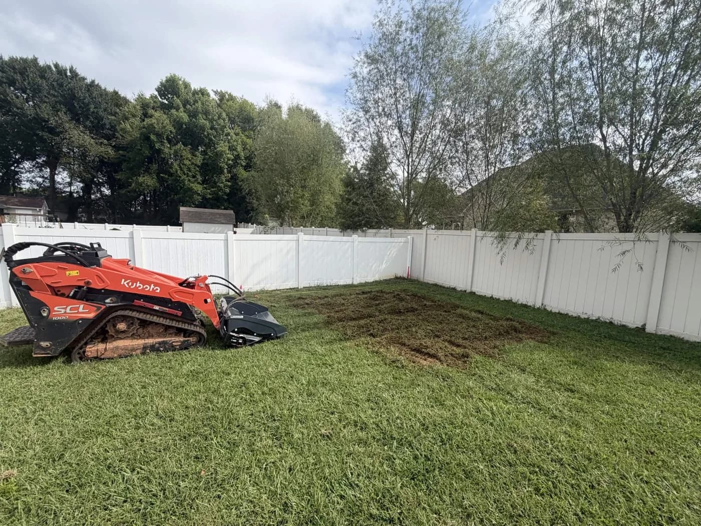 Ground preparation before Urban Lawn & Landscape installed a backyard gravel pad