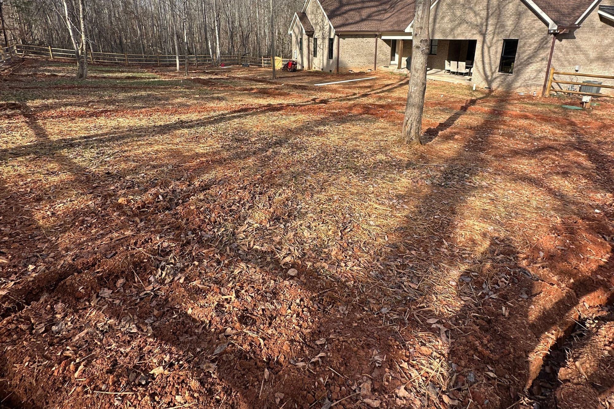 Ground preparation in an Urban Lawn & Landscape lawn-leveling project